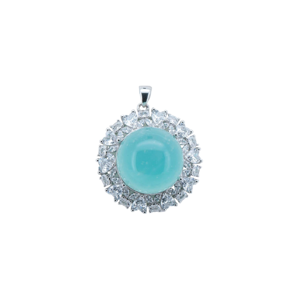 Turquoise pendant with silver frame on a white background
