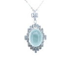 Silver pendant with a light blue gemstone on a white background