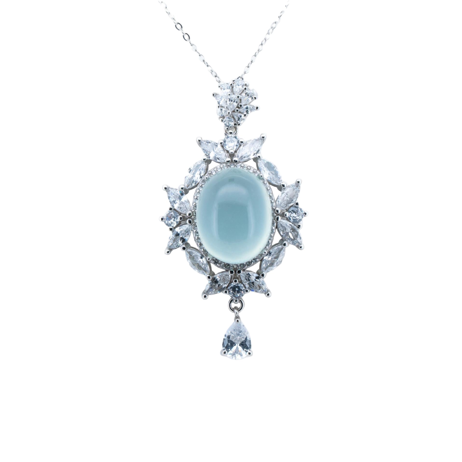 Elegant necklace with a central blue gemstone and diamond-like stones on a white background