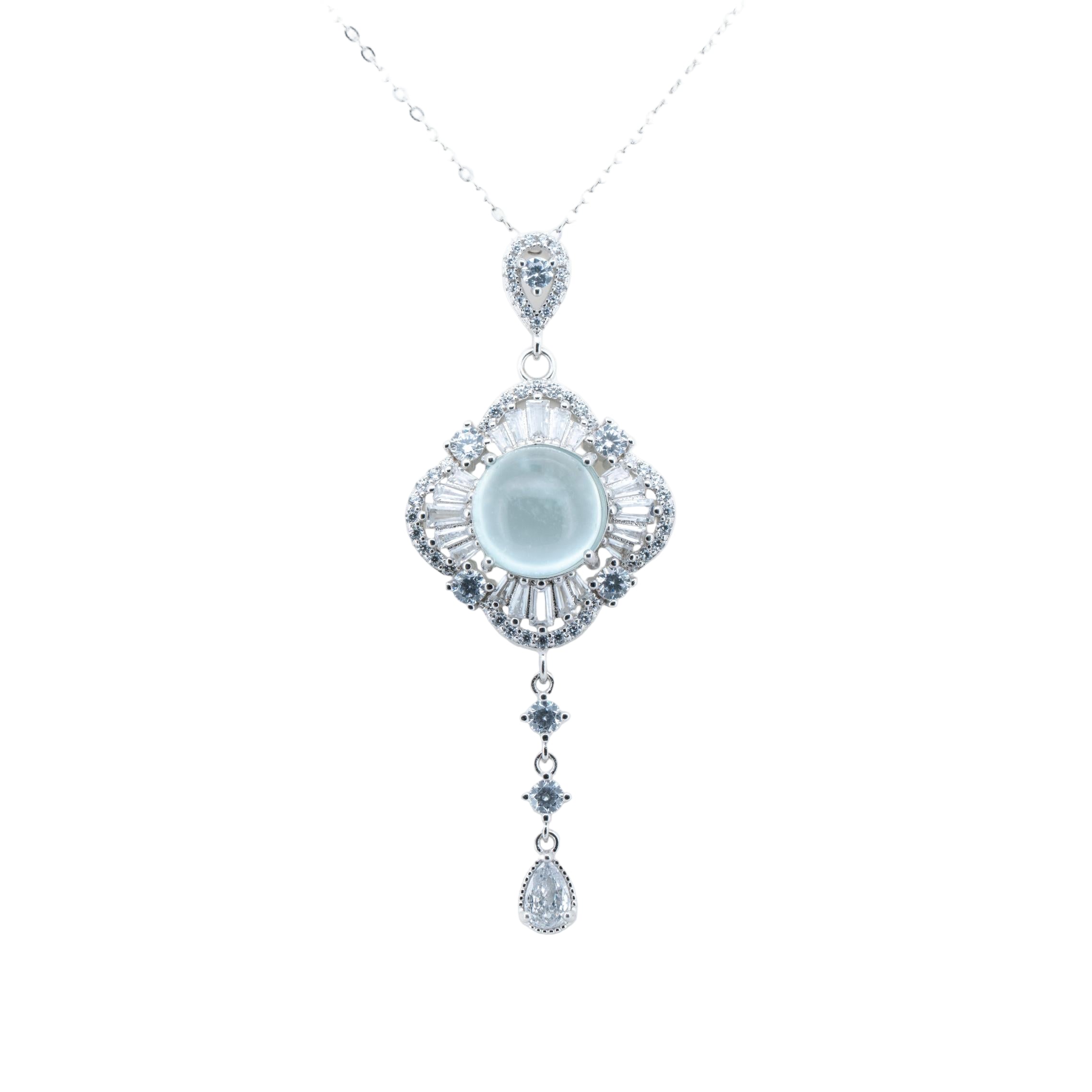 Elegant diamond necklace with a central gemstone and teardrop pendant on a white background