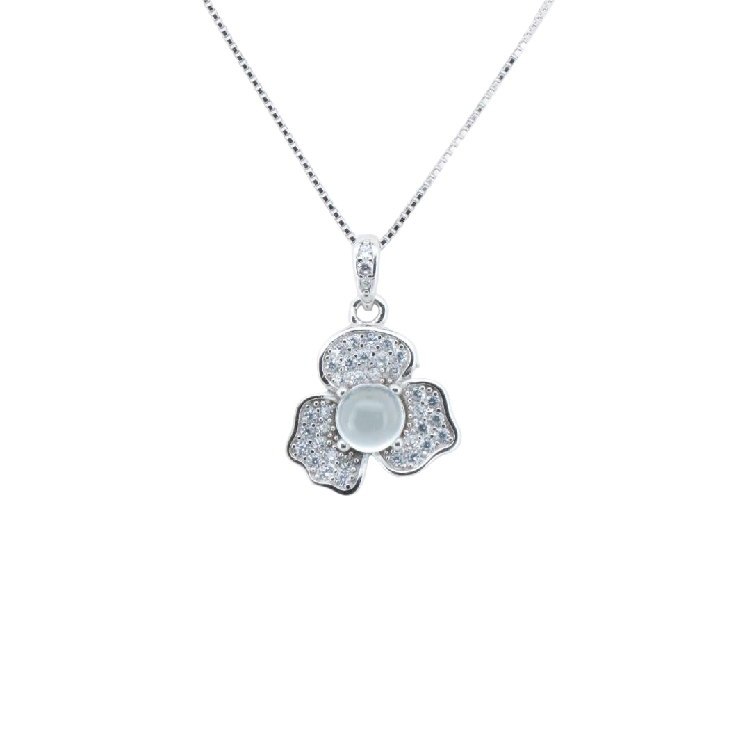 Silver flower-shaped pendant necklace on a white background