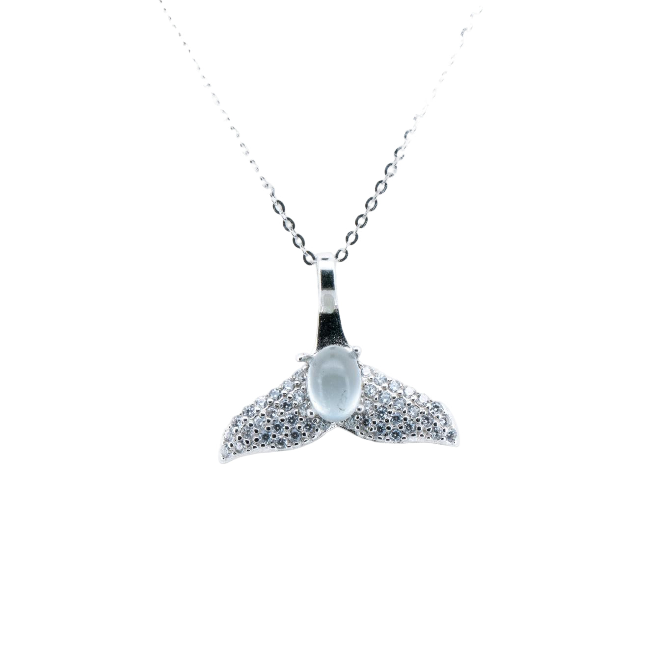 Whale tail pendant necklace with clear gemstone on a white background