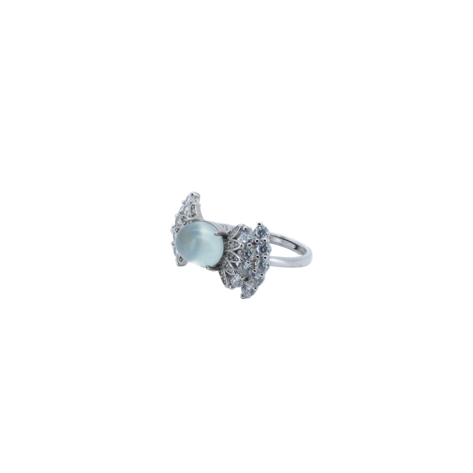 Silver ring with a light blue gemstone on a white background