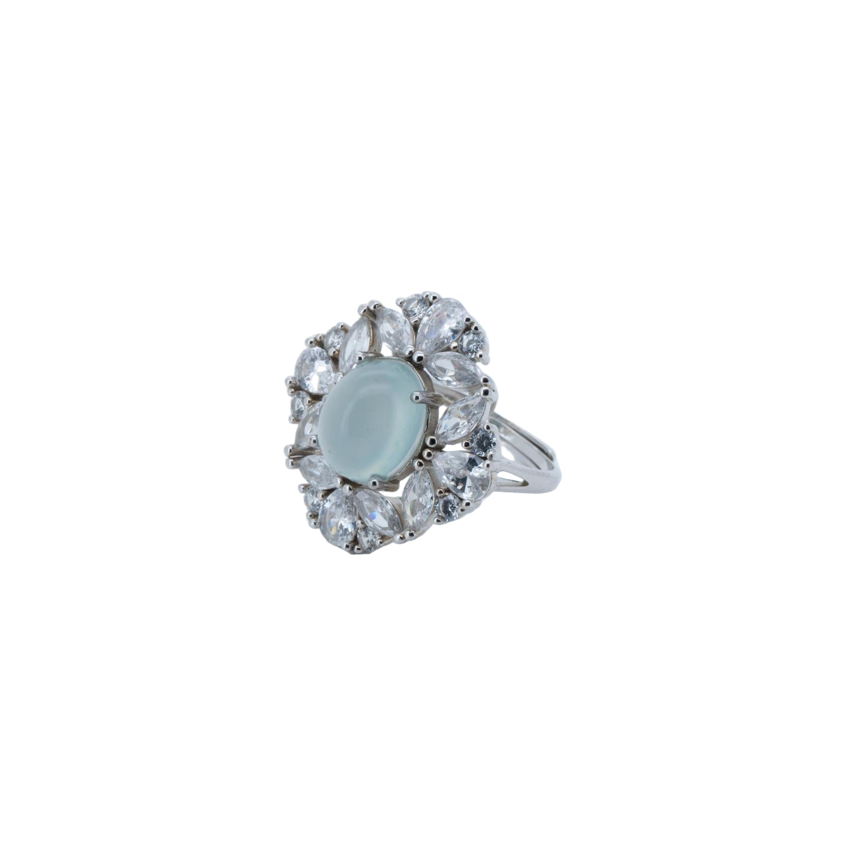 Silver ring with a light blue gemstone and clear stones on a light gray background